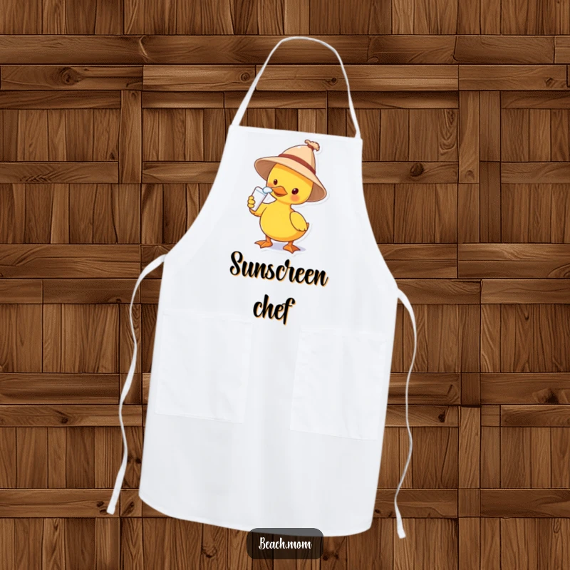 Funny apron showing a duck wearing a sun hat and applying sunscreen to its nose, perfect for kitchen use and adding humor.