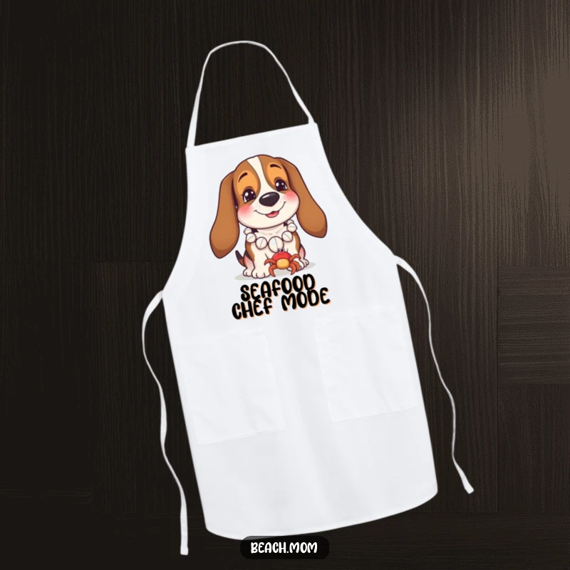 Funny Basset Hound apron showing a dog in a seashell necklace smiling at a crab, bringing coastal charm to the kitchen.