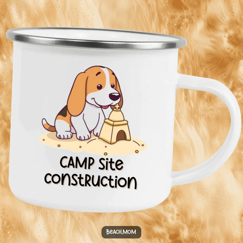 Funny Basset Hound camping mug showing a dog intensely focused on building a small sandcastle by the water.