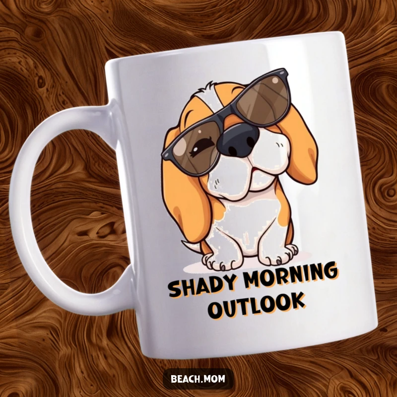 Funny Basset Hound mug shows a dog winking with cool sunglasses playfully tipped down its nose.