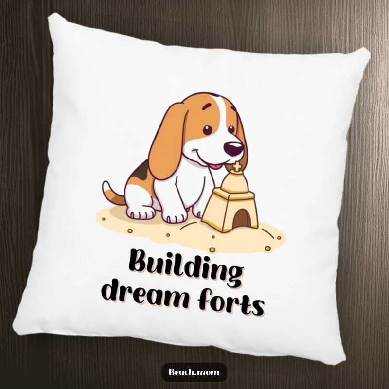 Funny Basset Hound pillow featuring a dog intently focused on building a small yet impressive sandcastle.