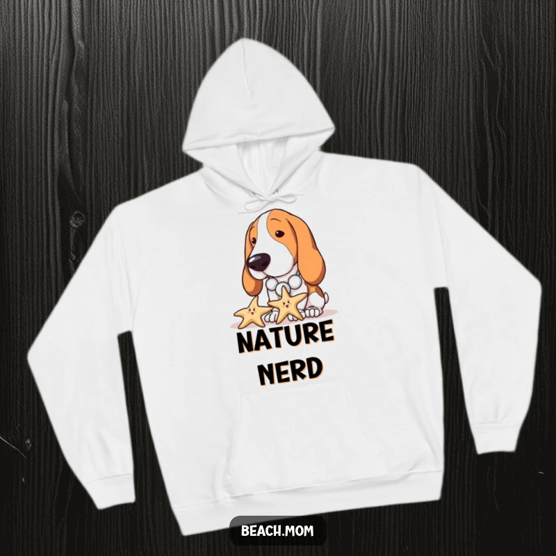 Funny Basset Hound hoodie with a dog wearing a seashell necklace, curiously inspecting a starfish, perfect for cozy exploration.