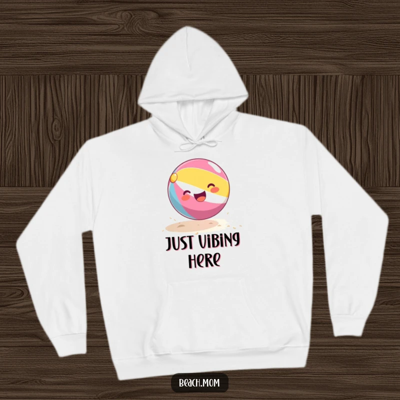 Funny beach ball hoodie showing a happy beach ball gleefully bouncing on golden sand, perfect for casual, fun wear.