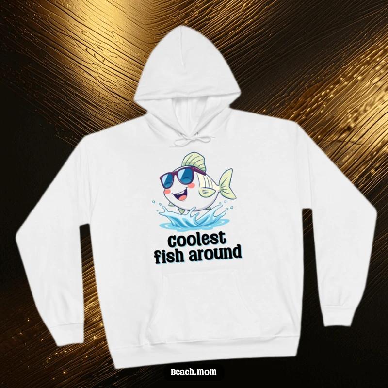 Funny fish hoodie, showing a smiling fish wearing sunglasses and happily splashing in a small wave, embodying cool beach living.