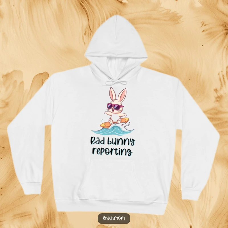 Funny Bunny Surfer hoodie depicting a cool bunny with sunglasses happily surfing a tiny wave, perfect for cozy beach-themed wear.