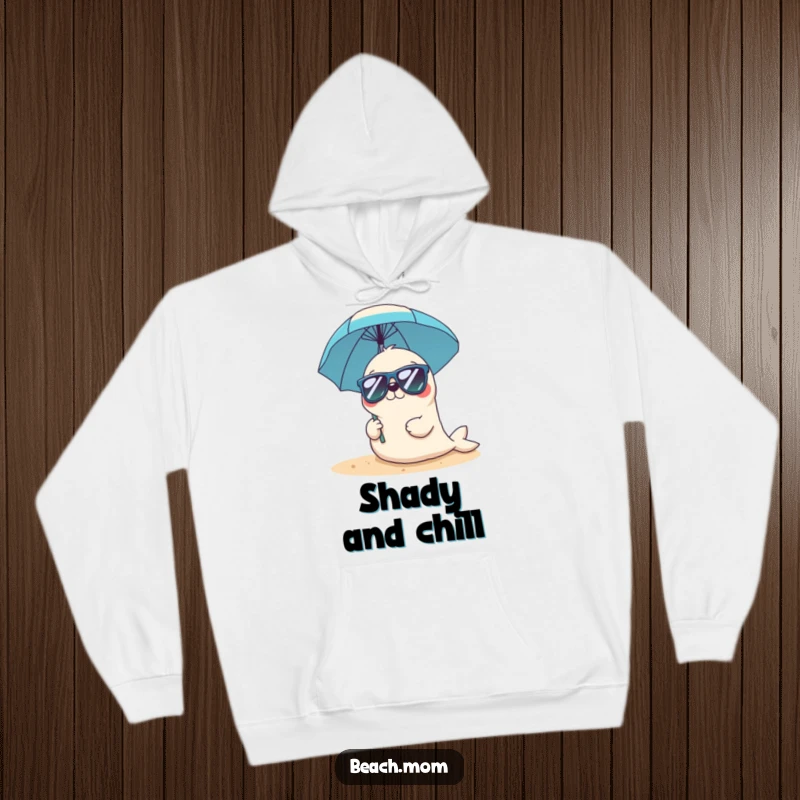 Funny Kawaii seal hoodie featuring a cute seal in sunglasses holding a beach umbrella, offering cozy beachside charm.
