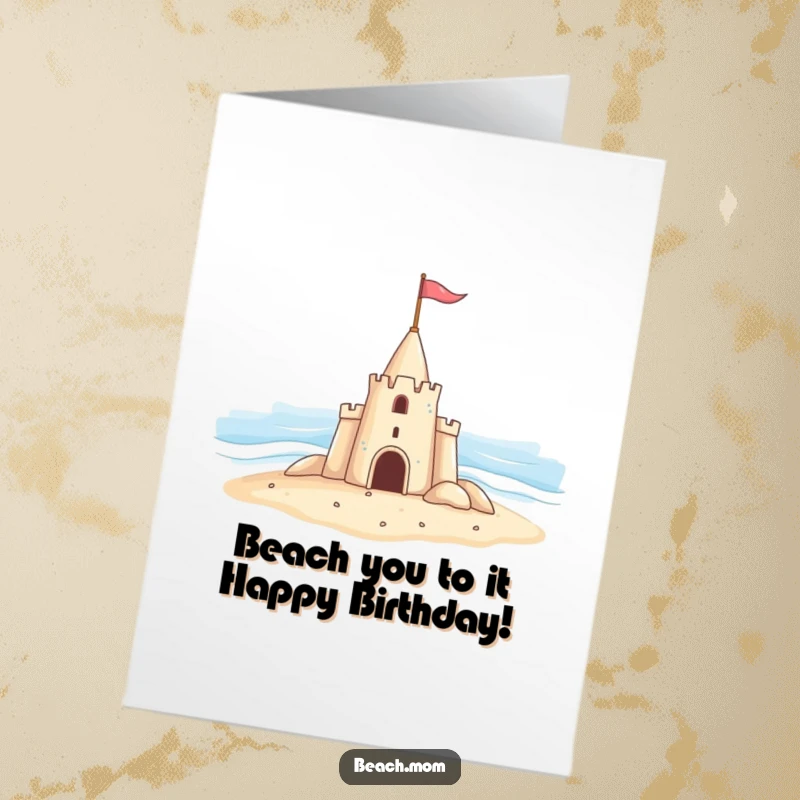 Funny Free Printable Birthday Card featuring a cheerful sandcastle with a tiny flag, waving hello to the ocean waves.