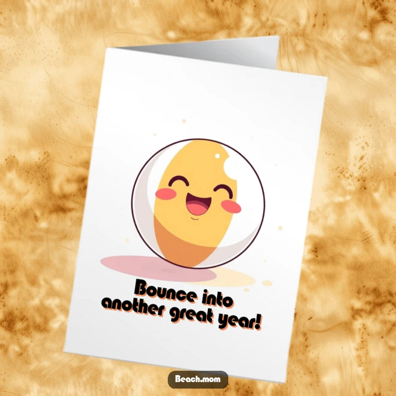 Funny Free Printable Birthday Card: Smiling beach ball joyfully bounces on sand, wishing happy birthday.