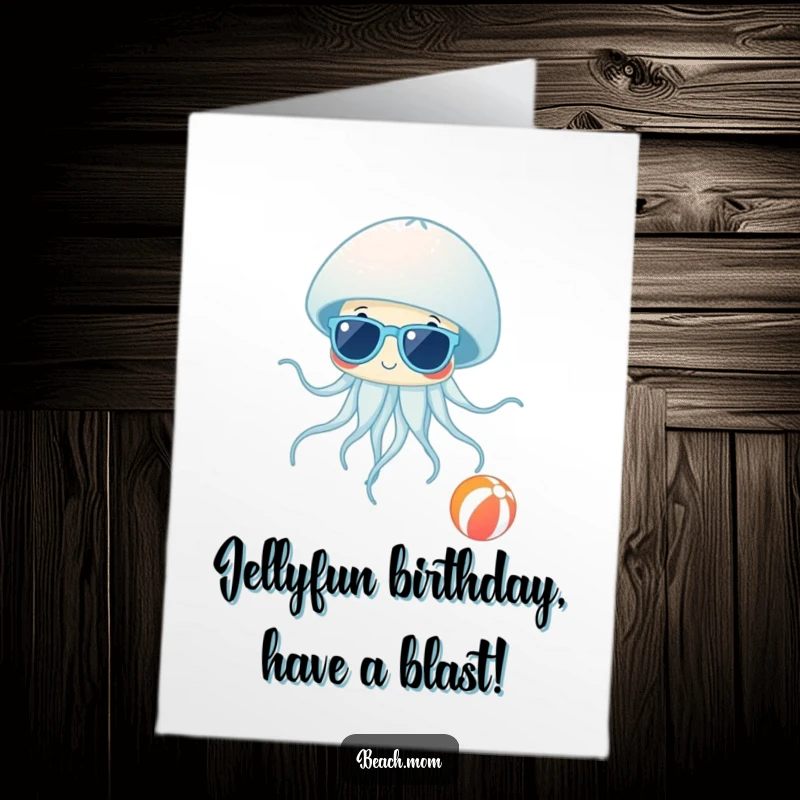 Funny Free Printable Birthday Card: Jellyfish wearing sunglasses, casually floating past a beach ball, embodying cool birthday vibes.