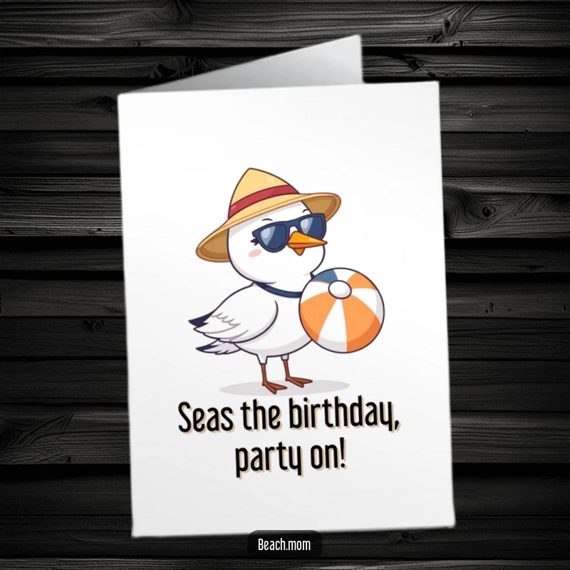 Funny free printable birthday card: A cool seagull in a sun hat and shades carries a beach ball, ready for party fun.
